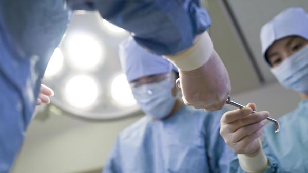 Doctors in surgery room working Doctors in surgery room working
